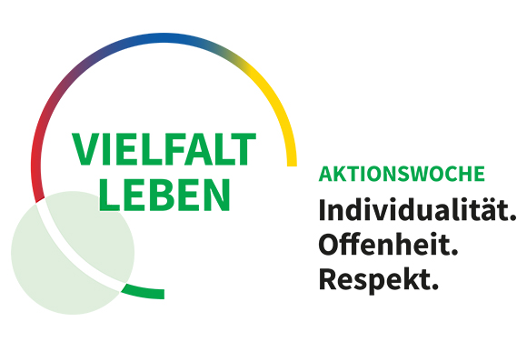bunter kreisförmiger Rahmen, darin in Großbuchstaben 